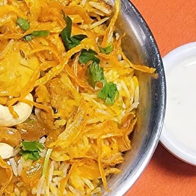 Chicken-Biriyani with Raita.